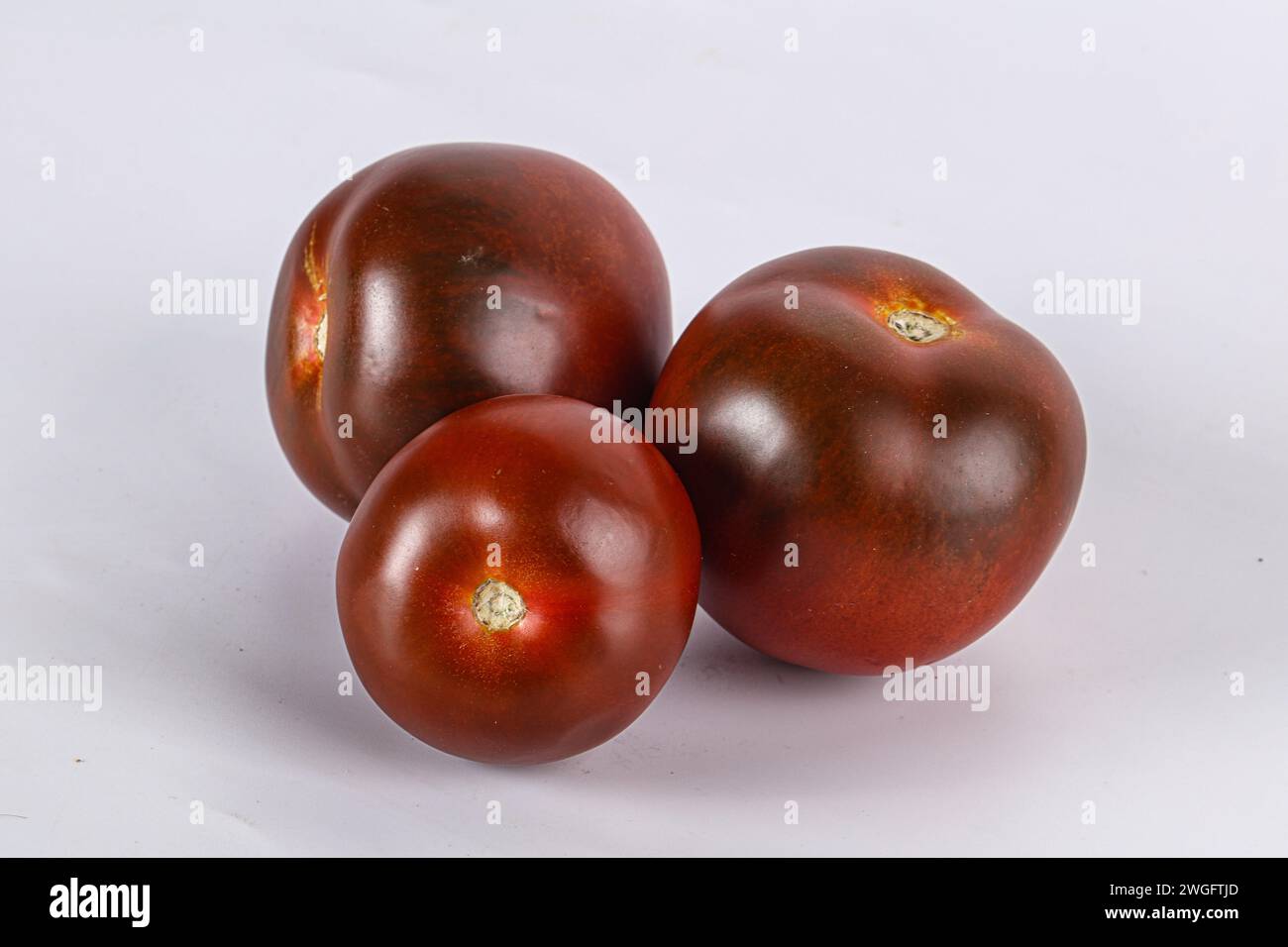 Organic natural juicy ripe Kumato tomato Stock Photo Alamy