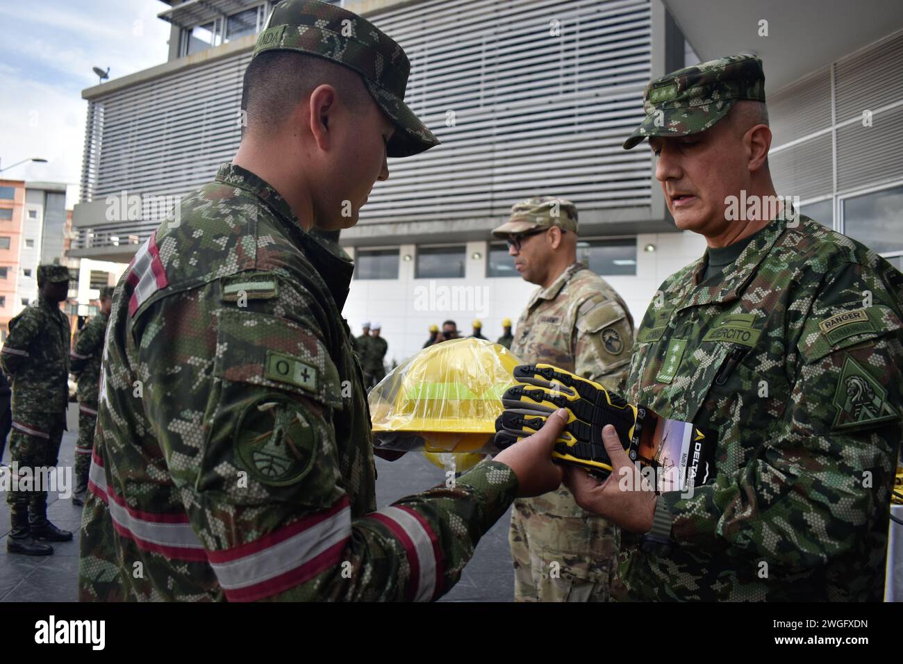 Bogota, Colombia. 02nd Feb, 2024. Colombian army general inspector General Juan Carlos Correa Consuegra (R) gives safety firefighting implements to a soldier during an event where the United States army delivered firefighting implements to Colombia's army rescuers in Bogota, Colombia, February 2, 2024. The Colombian Army received these firefighting kits in the midst of draughts and forest fires caused by the Nino Phenomena. Photo by: Cristian Bayona/Long Visual Press Credit: Long Visual Press/Alamy Live News Stock Photo
