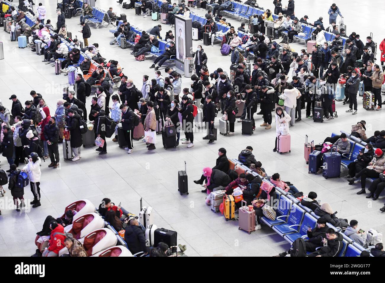 Passengers wait for their trains at Changchun railway station in