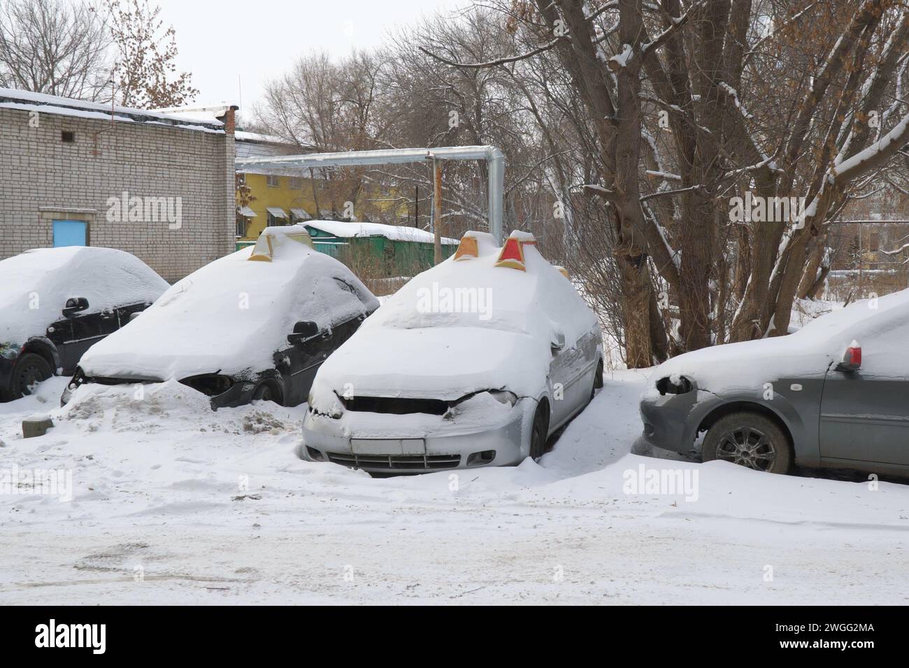 Cars covered with snow in the Parking lot Stock Photo - Alamy