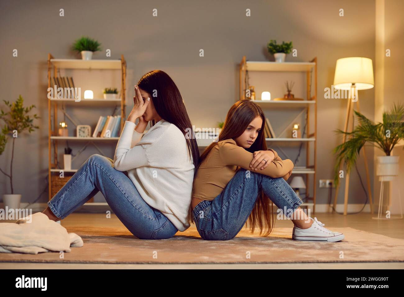 Mother and daughter conflict, miscommunication sitting back to each other Stock Photo
