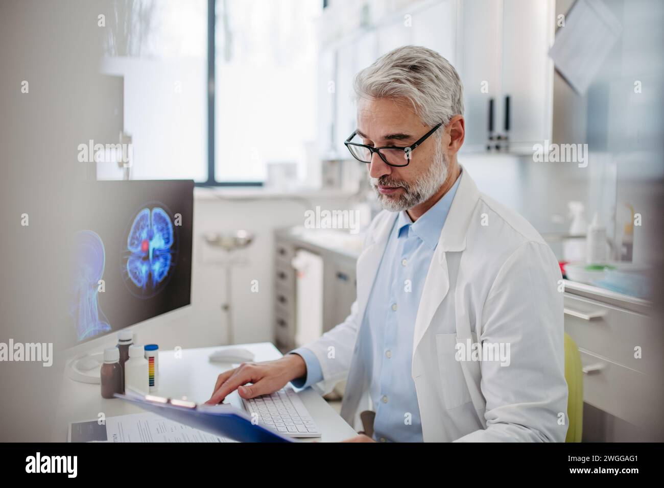 Sad doctor looks at an MRI scan, patient