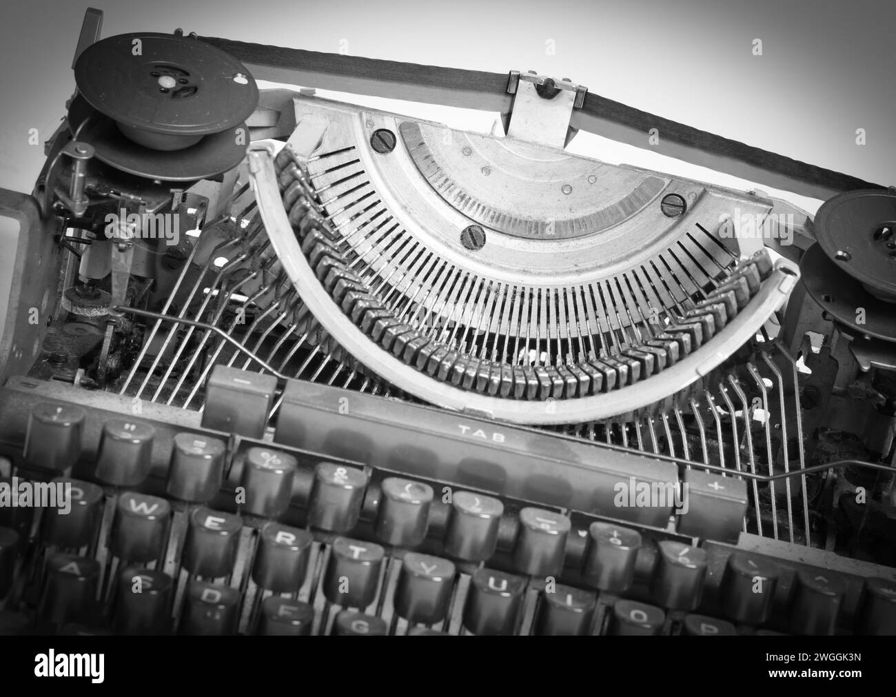 Broken metal typewriter, vintage object isolated, full frame Stock Photo