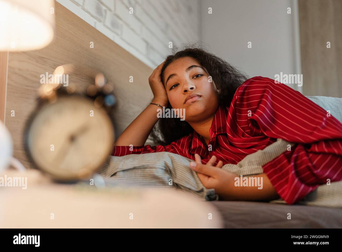 Woman can't fall asleep, insomnia a sleep problems. Concept of sleep routine and techniques for better sleep. Stock Photo