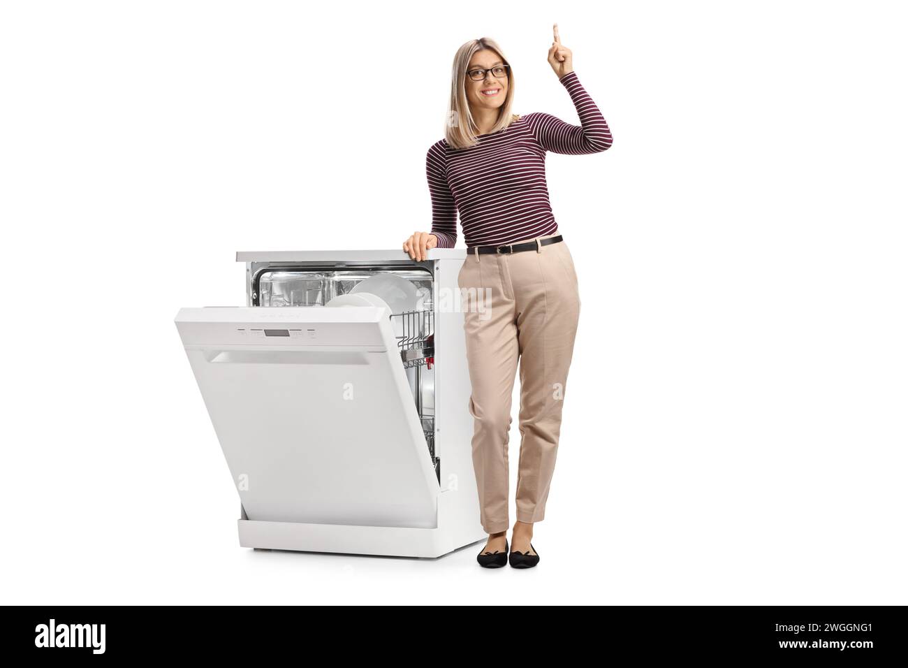 Full length portrait of a young woman leaning on a dishwasher and
