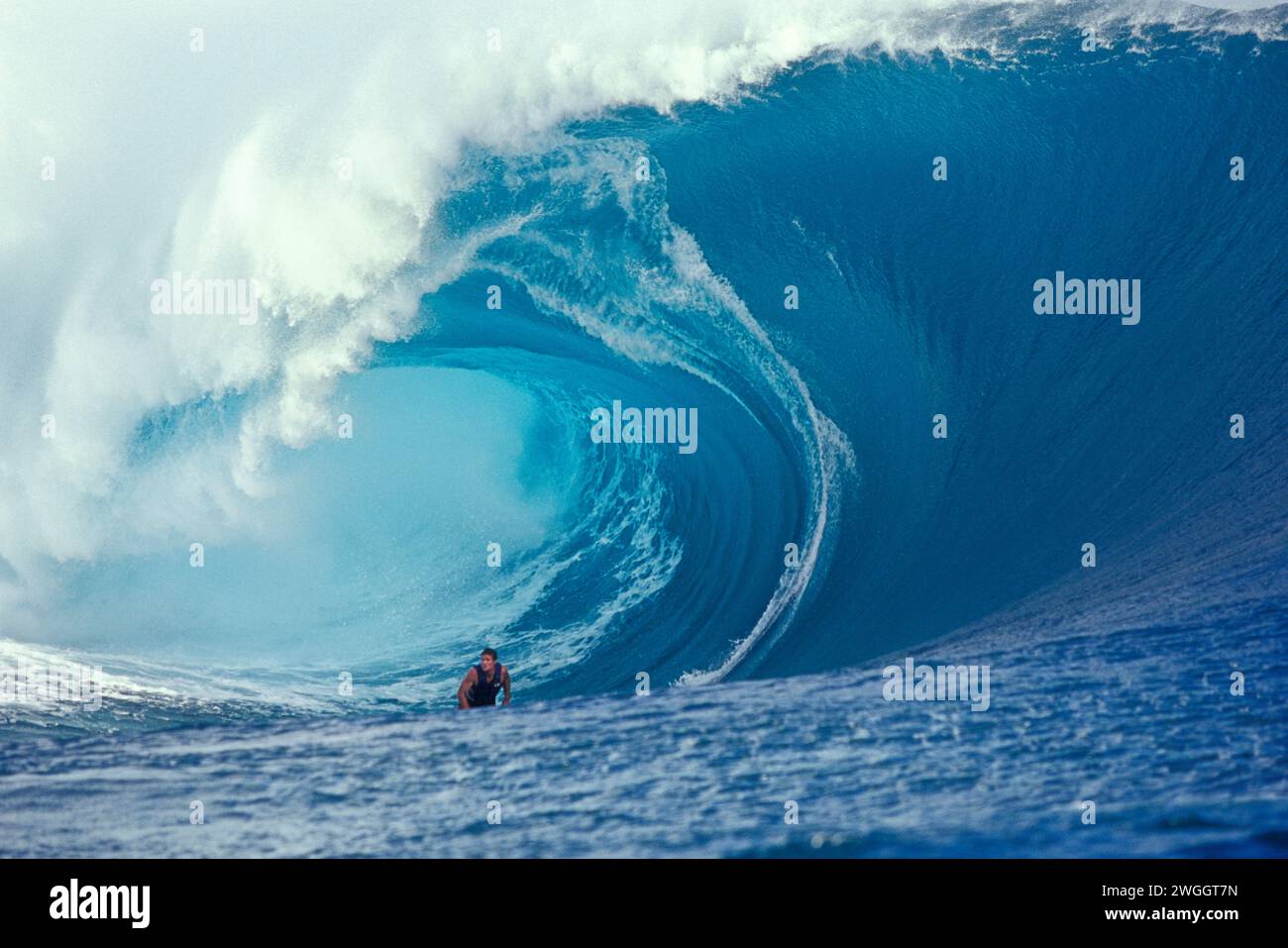 Joel Fitzgerald surfing a big dangerous tubing wave at Teahupoo, Tahiti