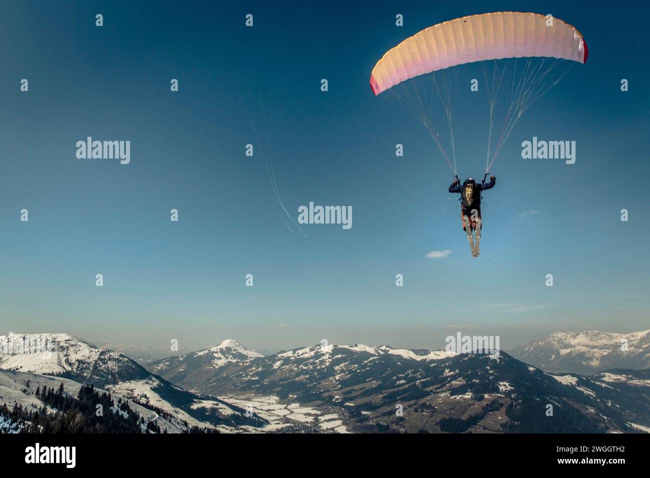 Man speed flying in winter in Austrian Alps, Kitzbuhel, Tyrol, Austria Stock Photo