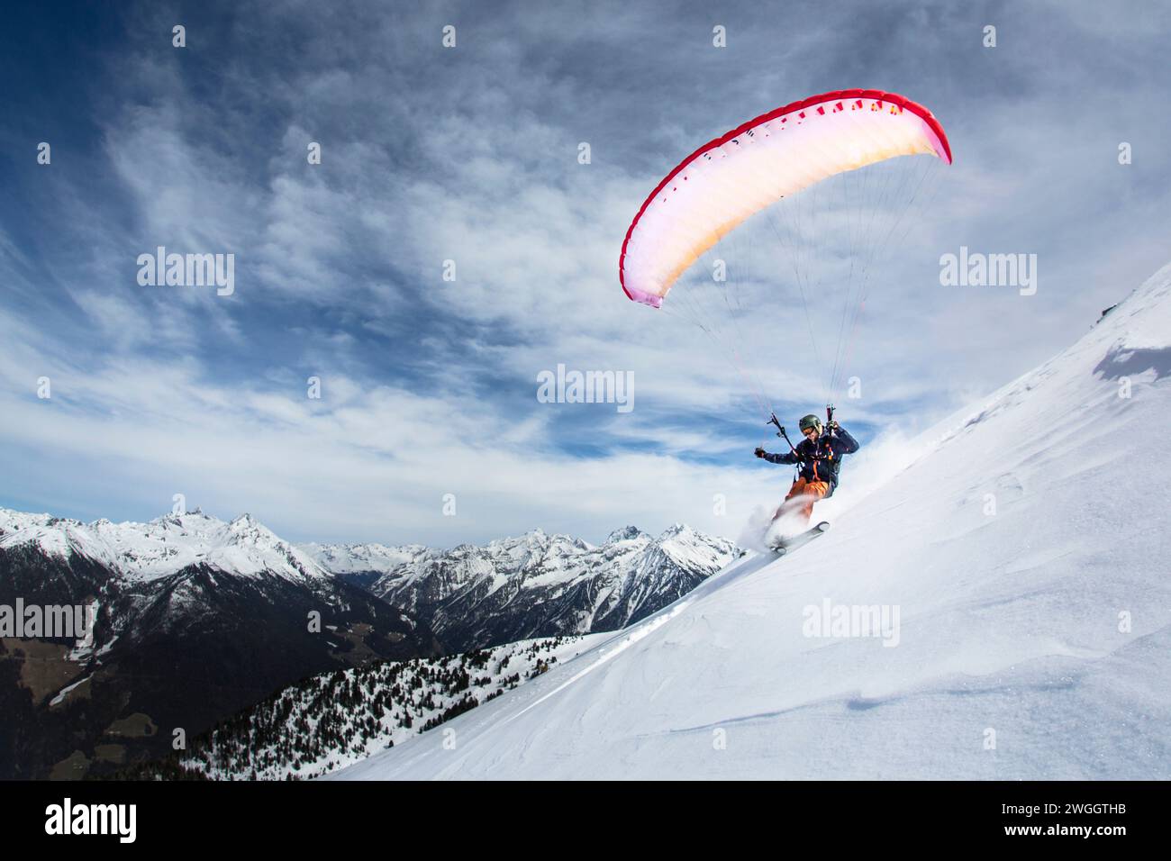Man speed flying in Alps, Brunico, South Tyrol, Italy Stock Photo