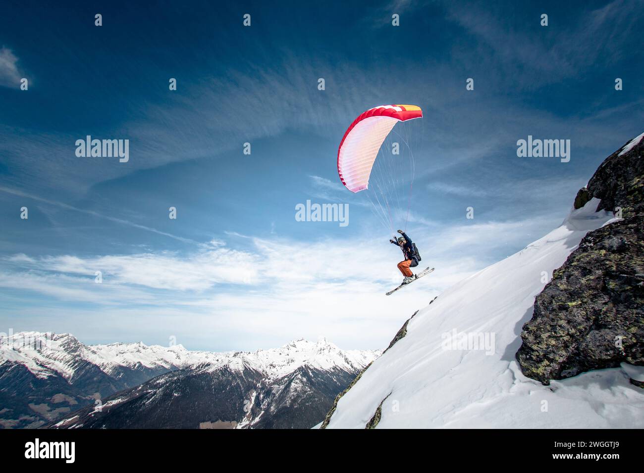 Man speed flying in Alps, Brunico, South Tyrol, Italy Stock Photo