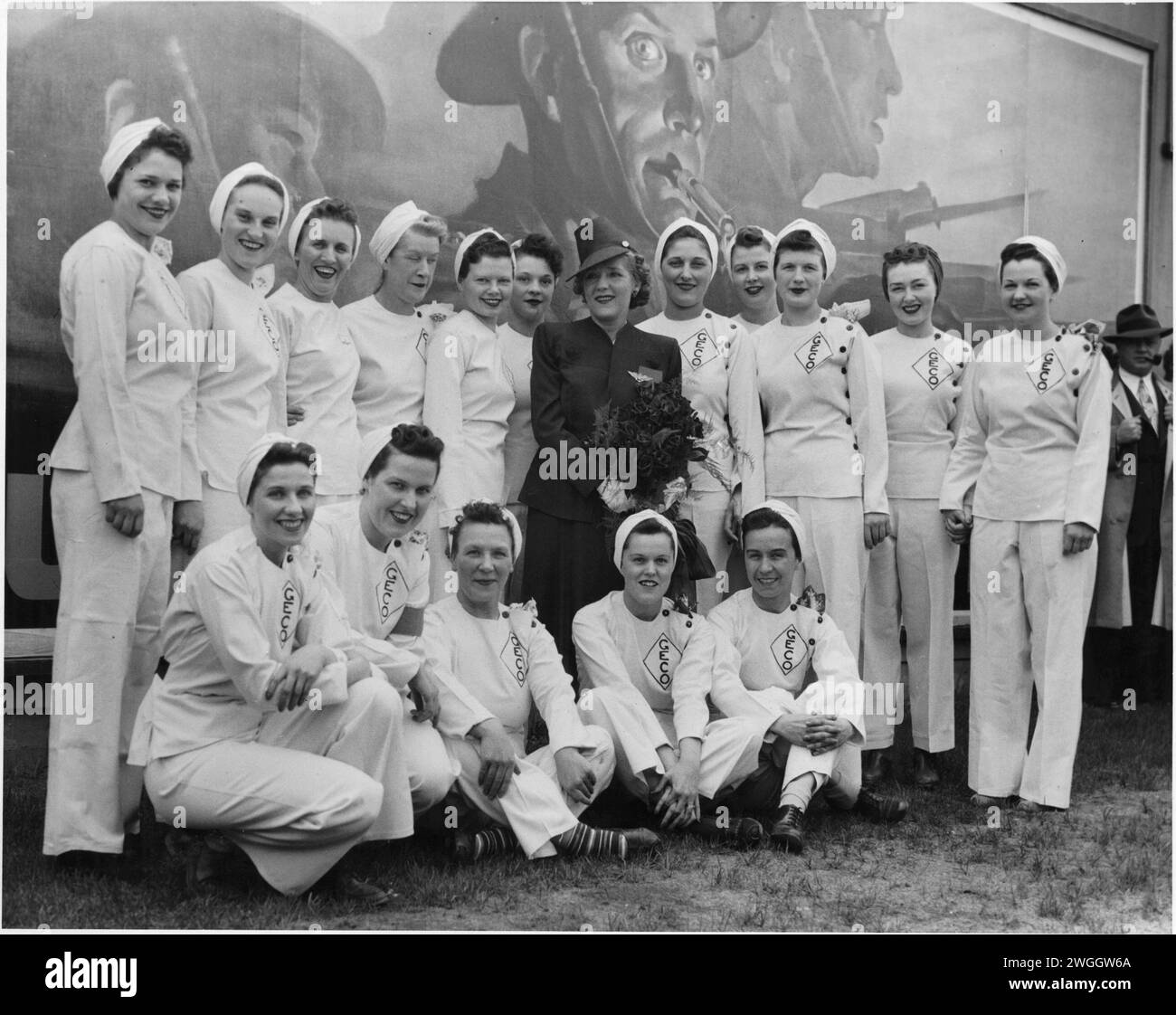Canadian Actress Mary Pickford posing with a group of employees during her visit to the General Engineering Company (Canada) munitions factory  in Scarborough, Ontario Circa 1943 Stock Photo