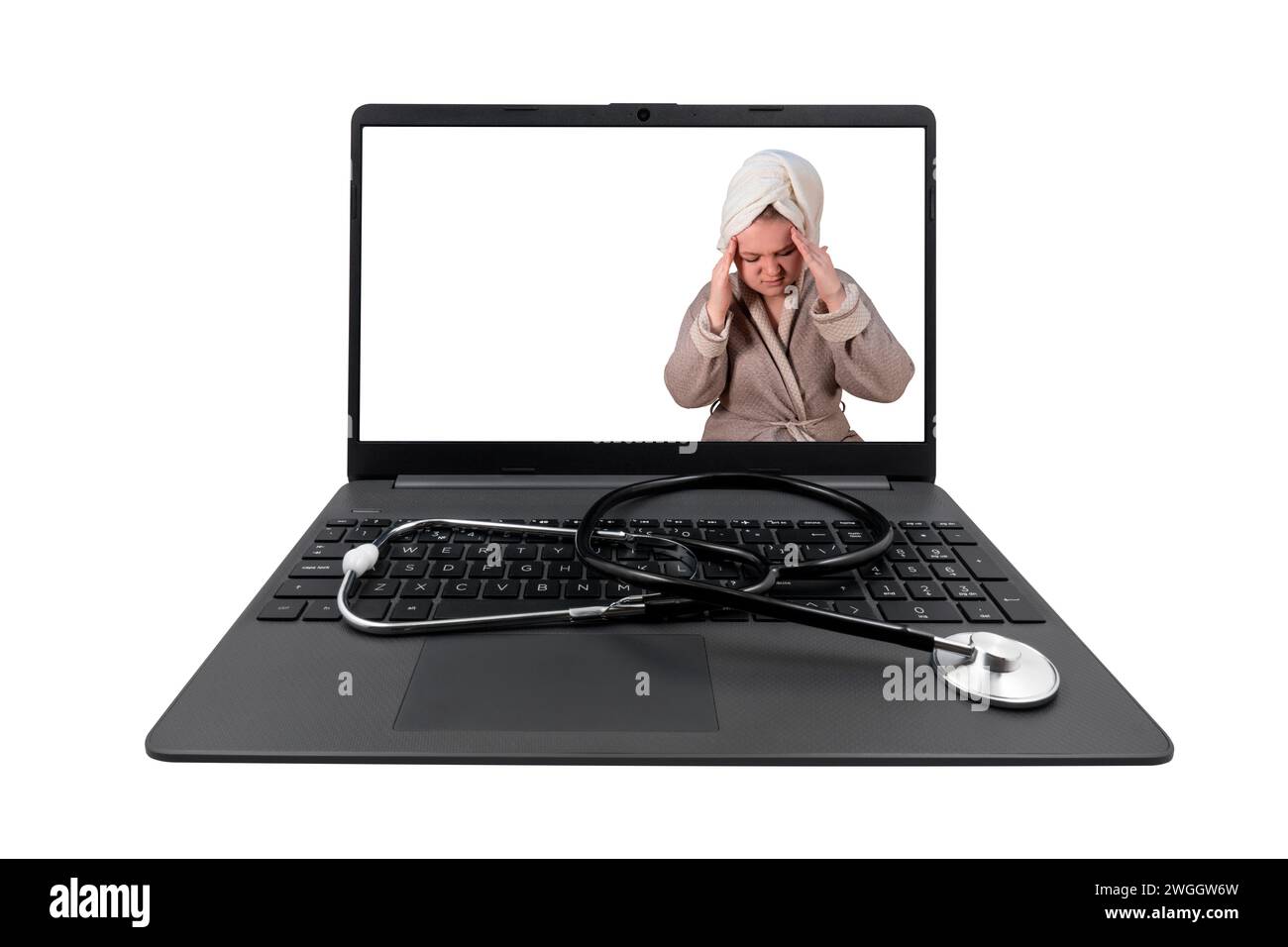 Laptop and medical stethoscope isolated on white background. On the laptop screen - a girl in a bathrobe clasped her head in her hands (headache) Stock Photo