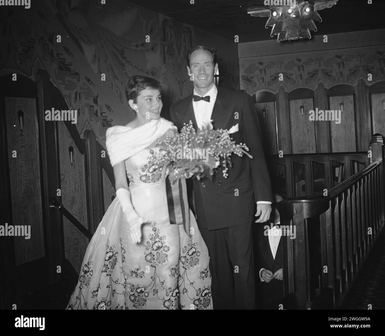 November 2, 1955. Amsterdam, Netherlands. Audrey Hepburn and Mel Ferrer at the gala screening of the film 'Sabrina' at Tuschinski in Amsterdam Stock Photo