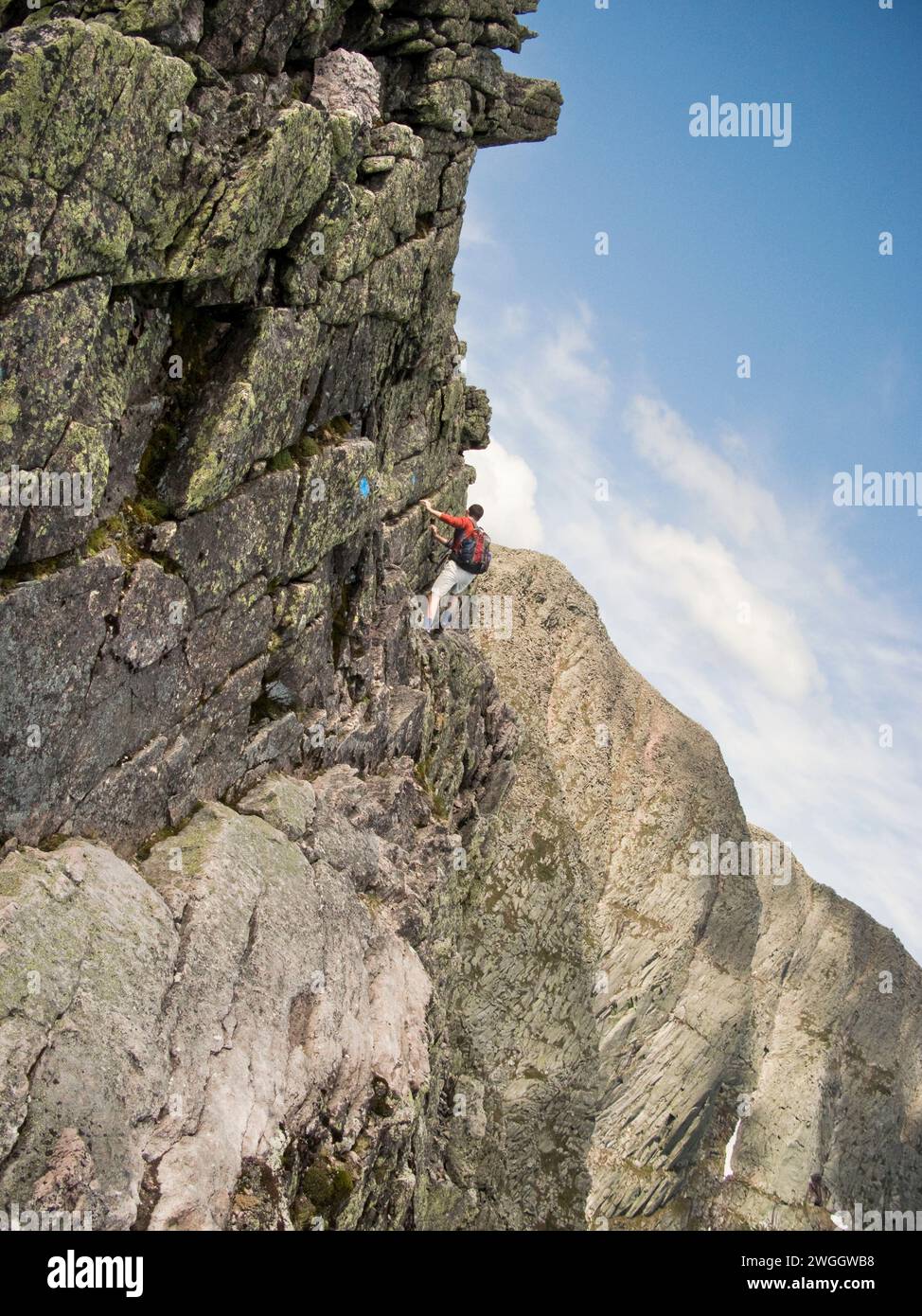 A hiker traverses the Knife Edge on Maine's Mount Katahdin Stock Photo ...