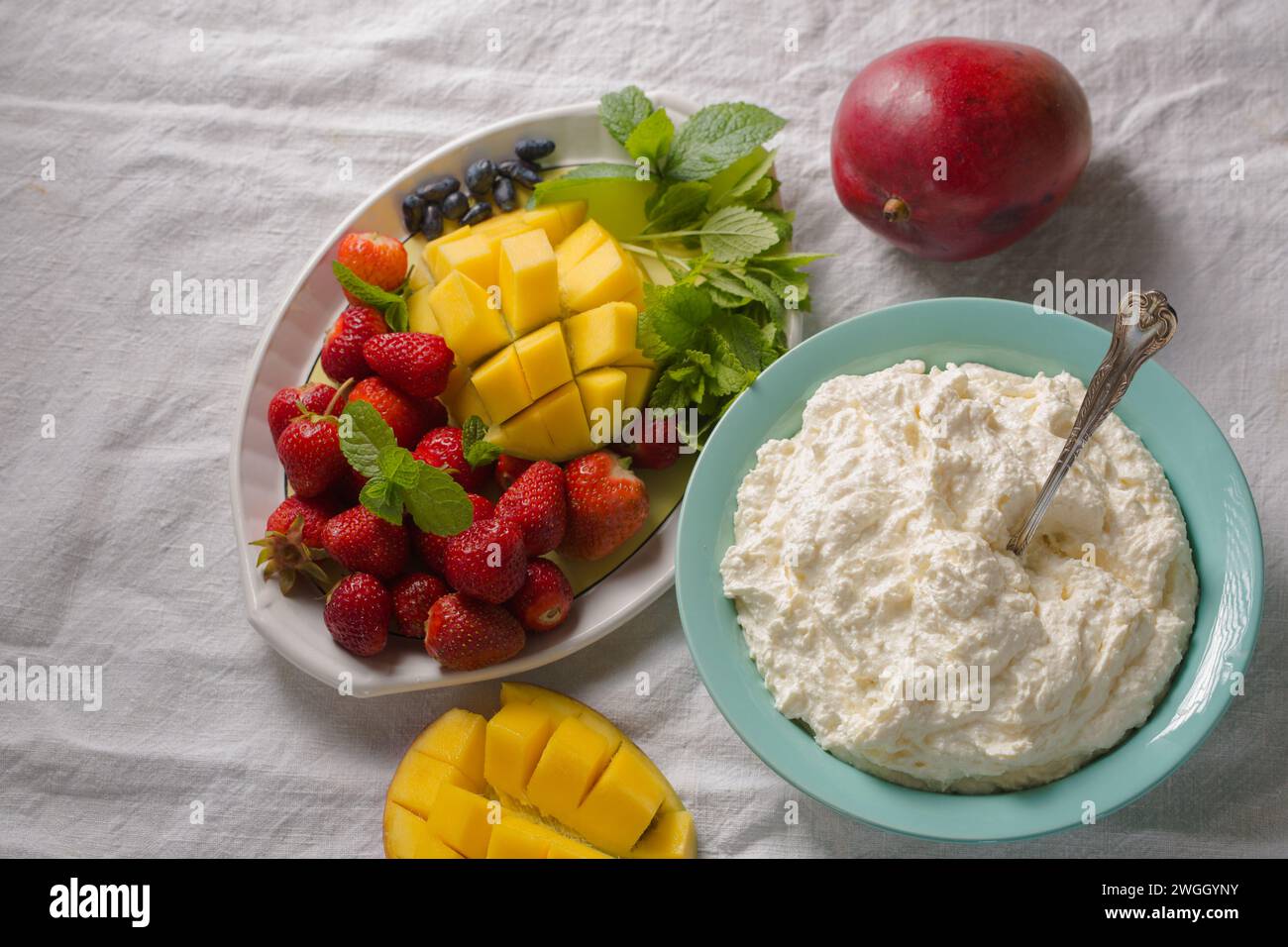 mango and strawberry cottage cheese dessert Stock Photo Alamy