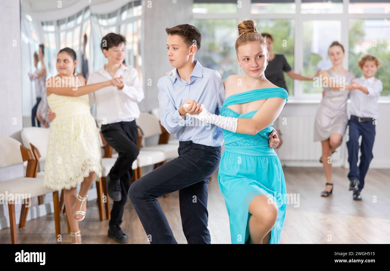 Boy and girl dancing twist in studio Stock Photo