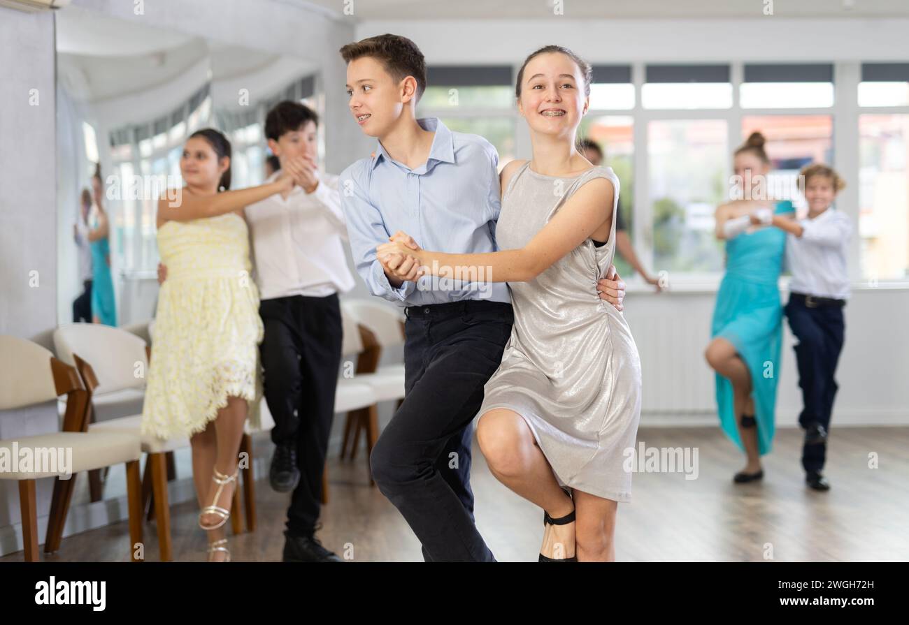 Boy and girl dancing twist in studio Stock Photo