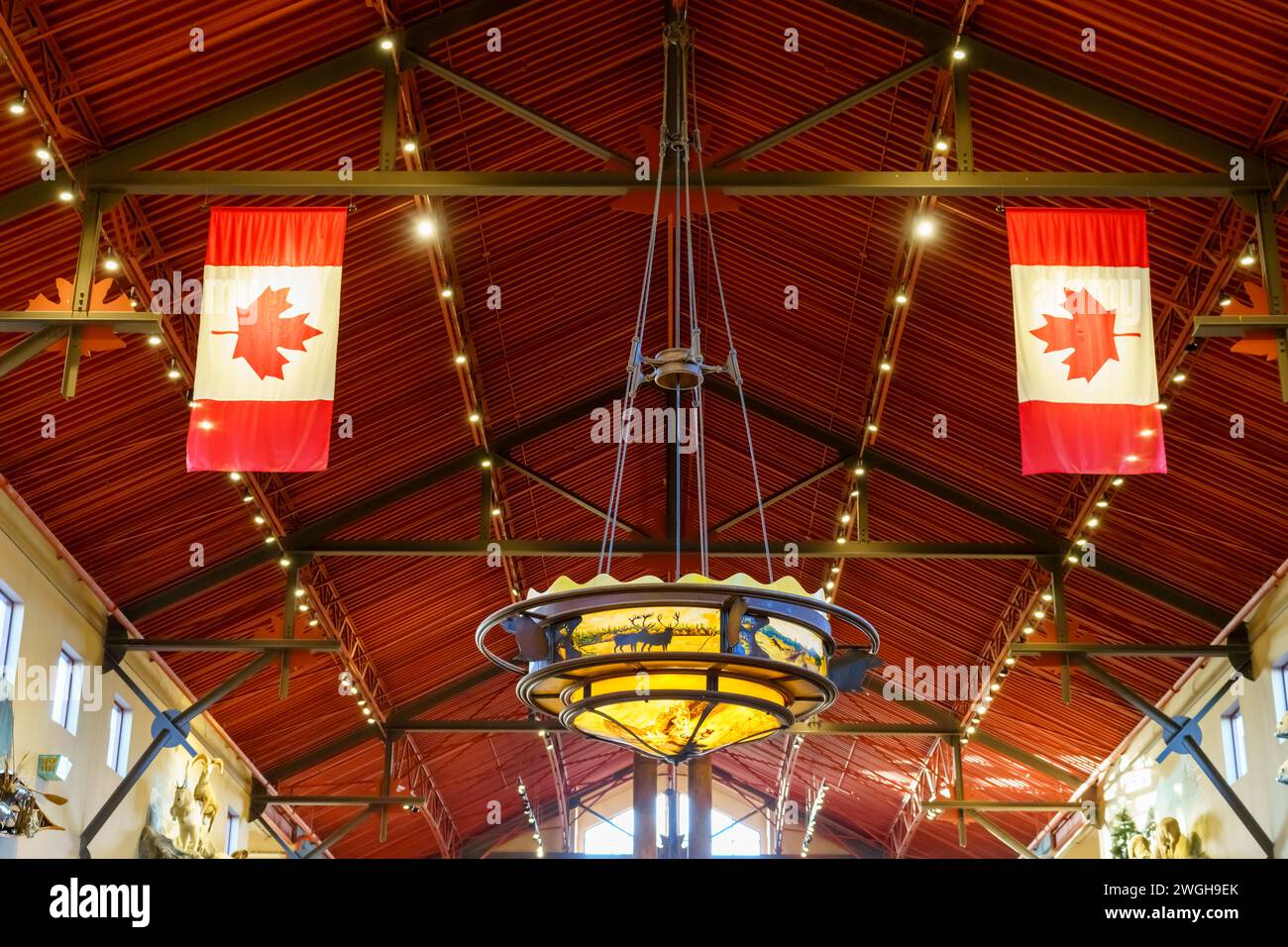 Symmetry of Canadian Flags and a large electric lamp in the Bas Pro Shop. The retail store is a famous place and an attraction in the Vaughan Mills sh Stock Photo