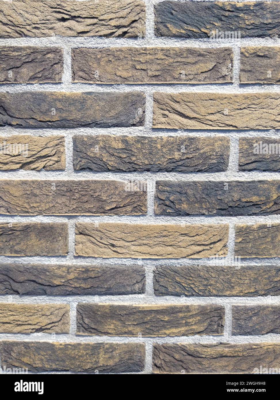 beige brick wall with detailed grooves Stock Photo