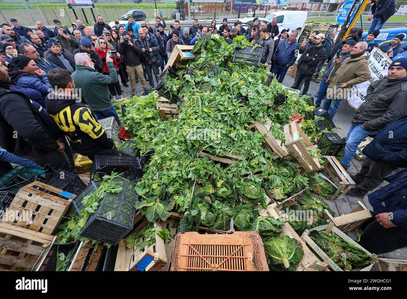 Farmers throw away their products, fruits and vegetables, during the