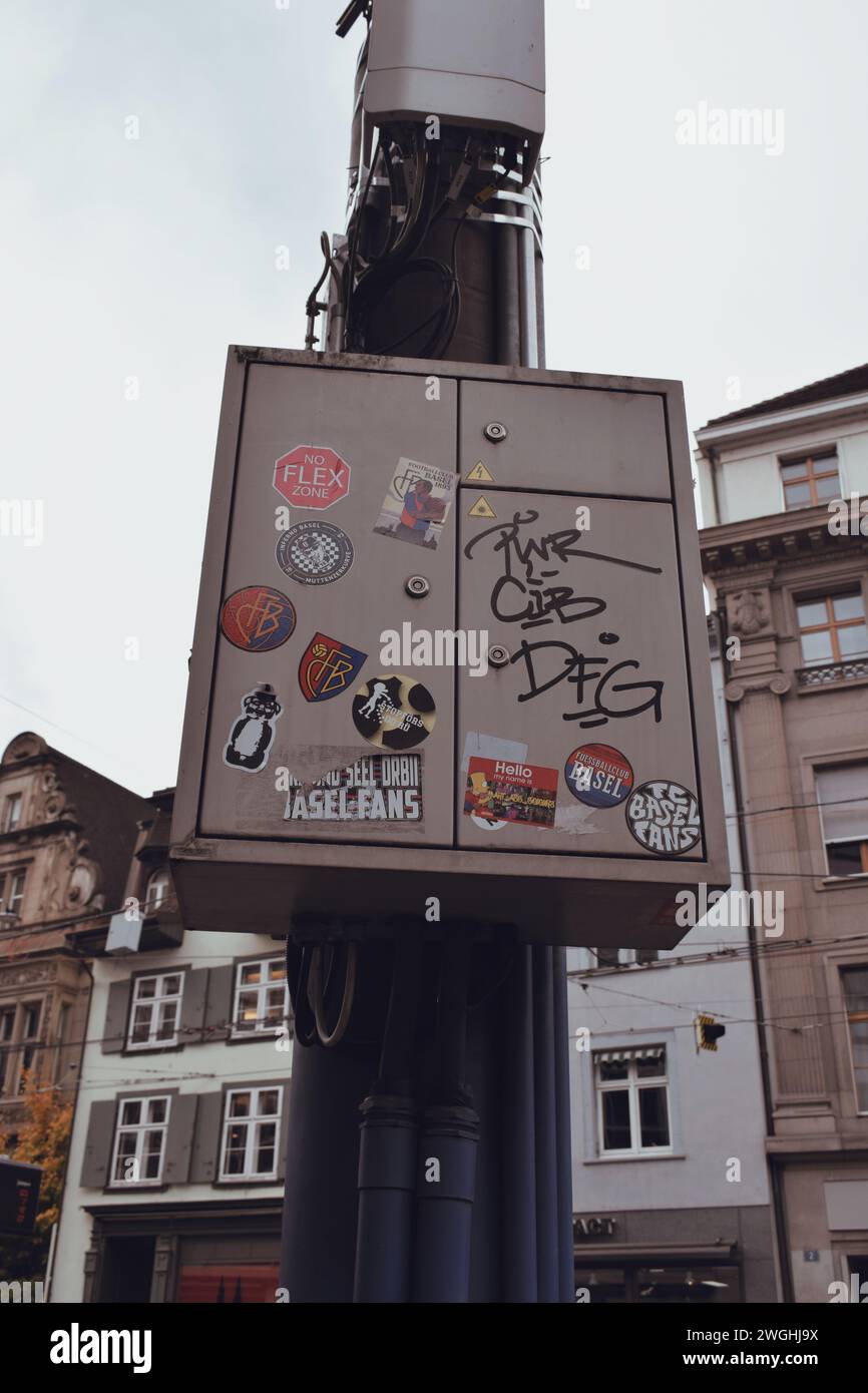 electric pole full of stickers in basel in switzerland on november 17, 2019 Stock Photo