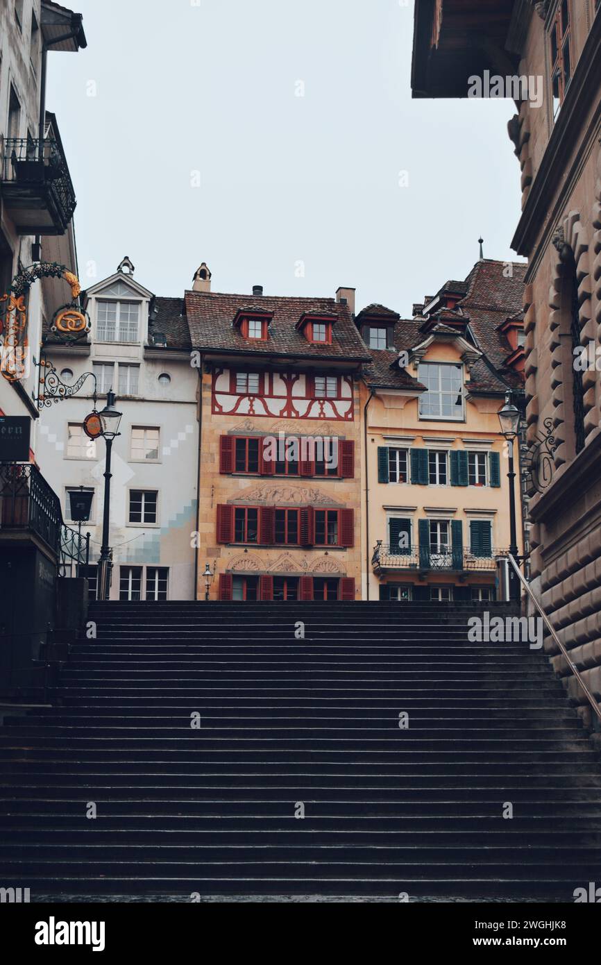 Old colorful houses at the bottom of a staircase in the center of Lucerne in Switzerland on November 20, 2019 Stock Photo