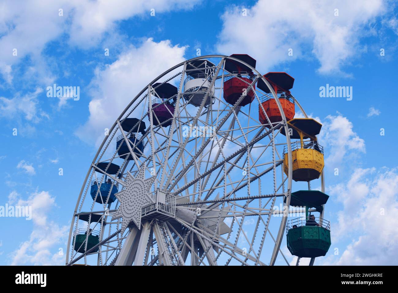 Colorful ferris wheel in the Tibidabo amusement park in Barcelona in the background, in Catalonia, Spain, on February 8, 2023 Stock Photo