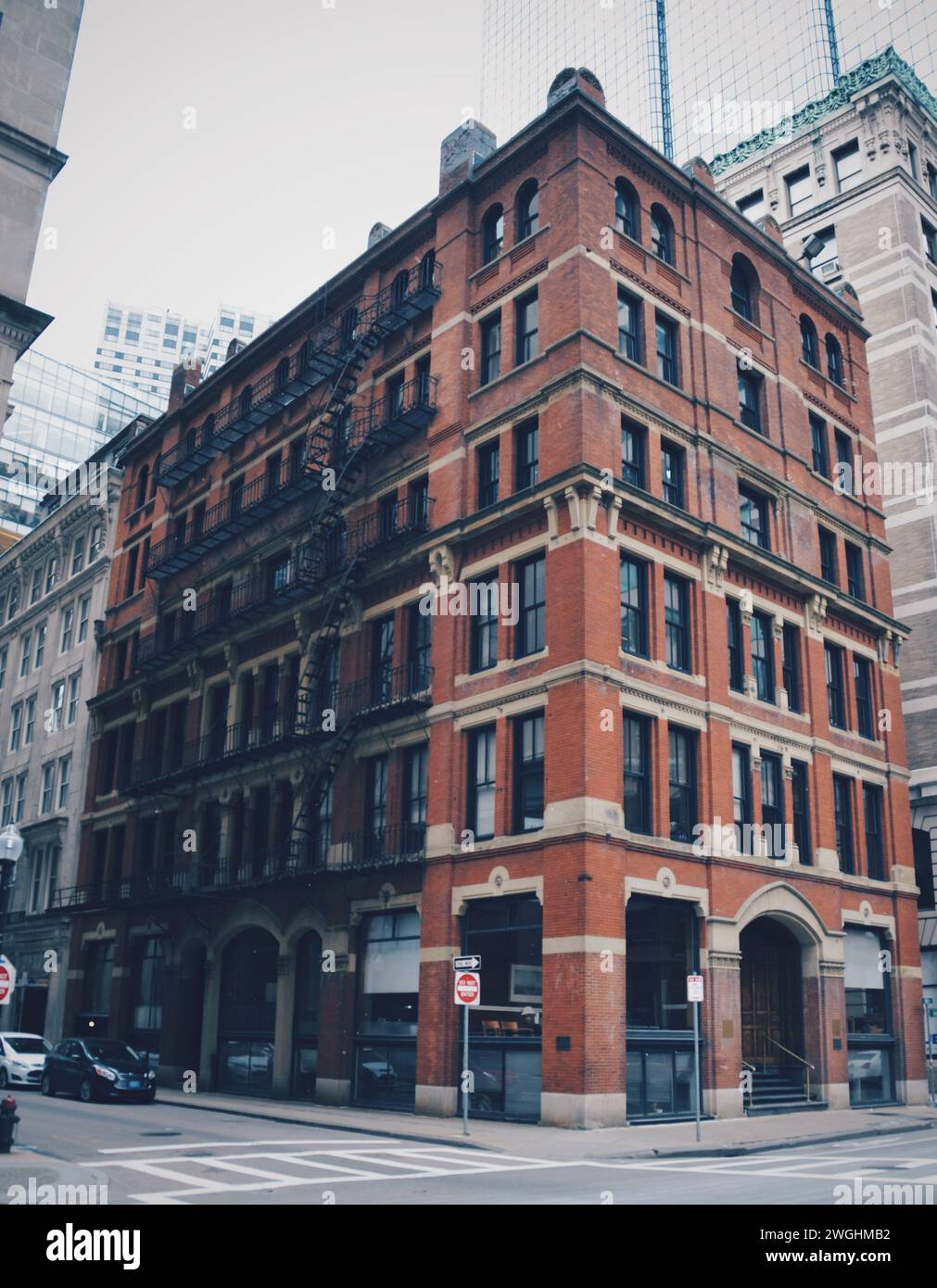 old brick building on a corner in Boston, United States, on February 12 ...
