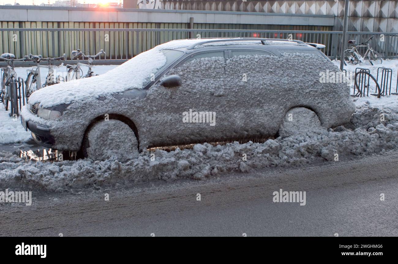 a car splattered with icy mud, Bavaria, Germany Stock Photo