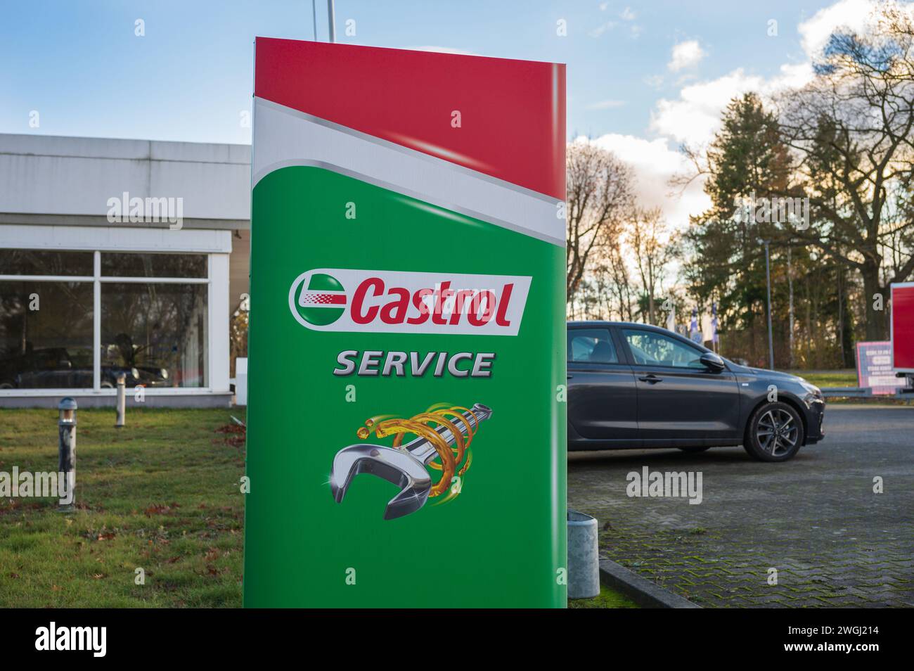 Germany , Finsterwalde , 26.11.2023 , A Castrol service sign in front of an independent workshop Stock Photo