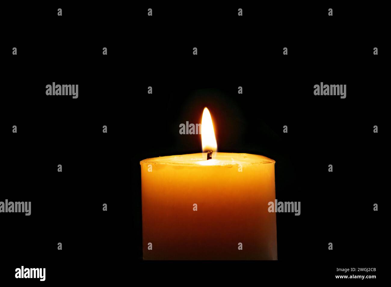 Candle burns Isolated On Black background Stock Photo - Alamy