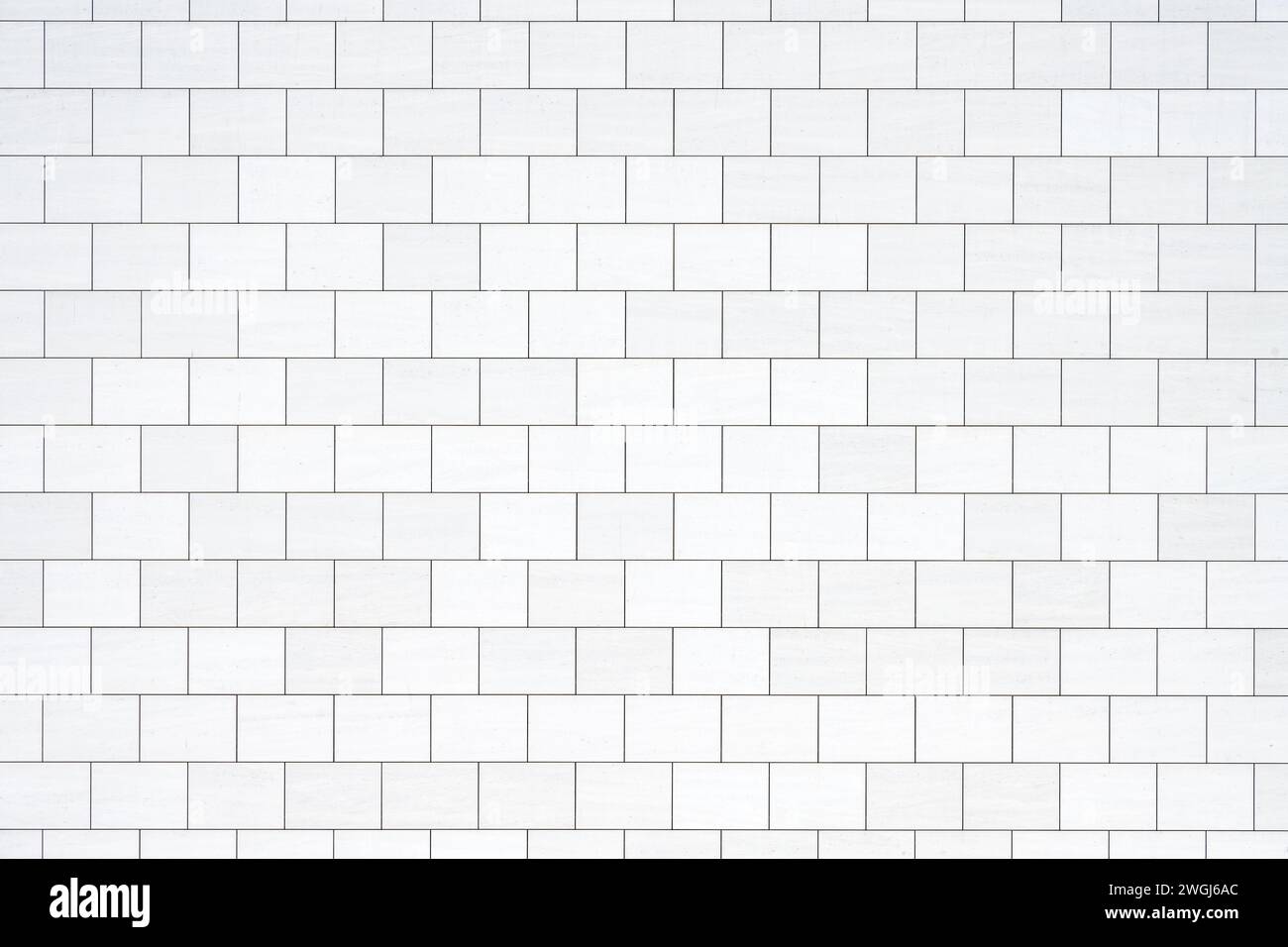 Background from a wall with rectangular white stone slabs Stock Photo