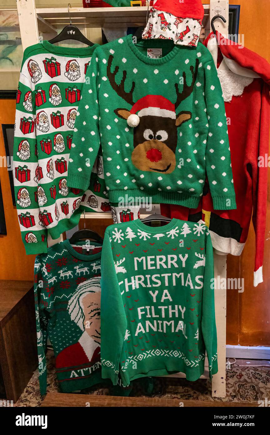Quirky Christmas jumpers for sale in market. Stock Photo