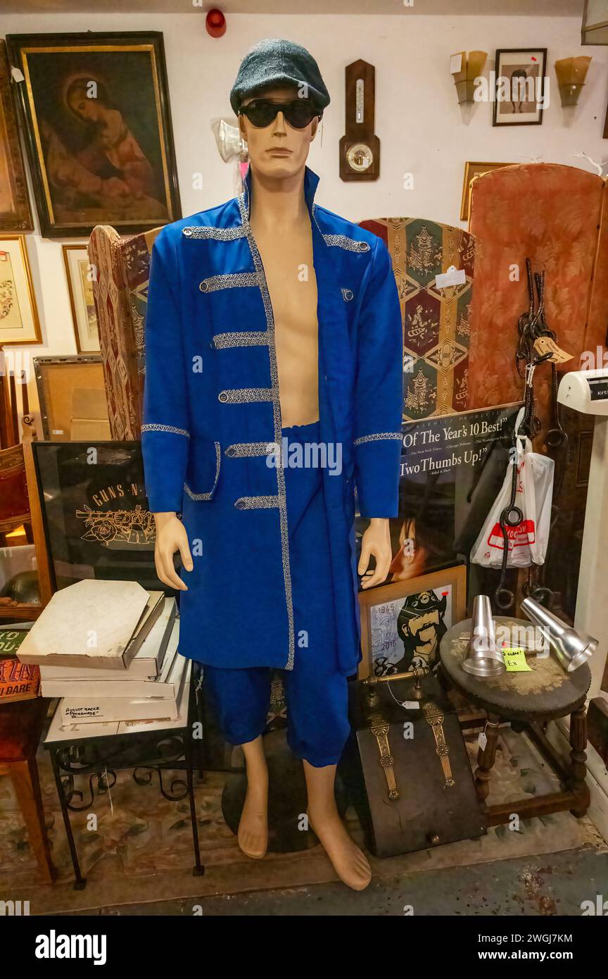 Mannequin display of vibrant blue suit with vintage militaruy style jcket. Stock Photo
