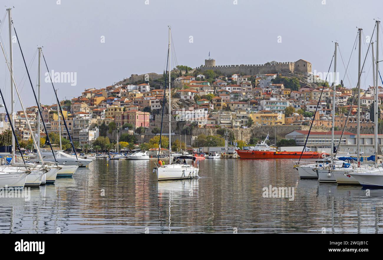 Kavala, Greece - October 22, 2023: Sailboats Motor Yachts Moored at Port of Kavala at Calm Fall Day. Stock Photo