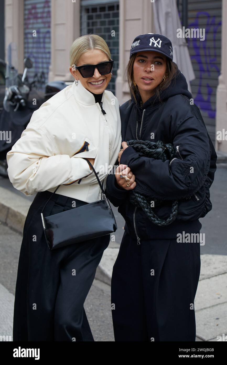 MILAN, ITALY - JANUARY 14, 2024: Caroline Daur with white bomber jacket and black trousers before K-Way fashion show, Milan Fashion Week street style Stock Photo