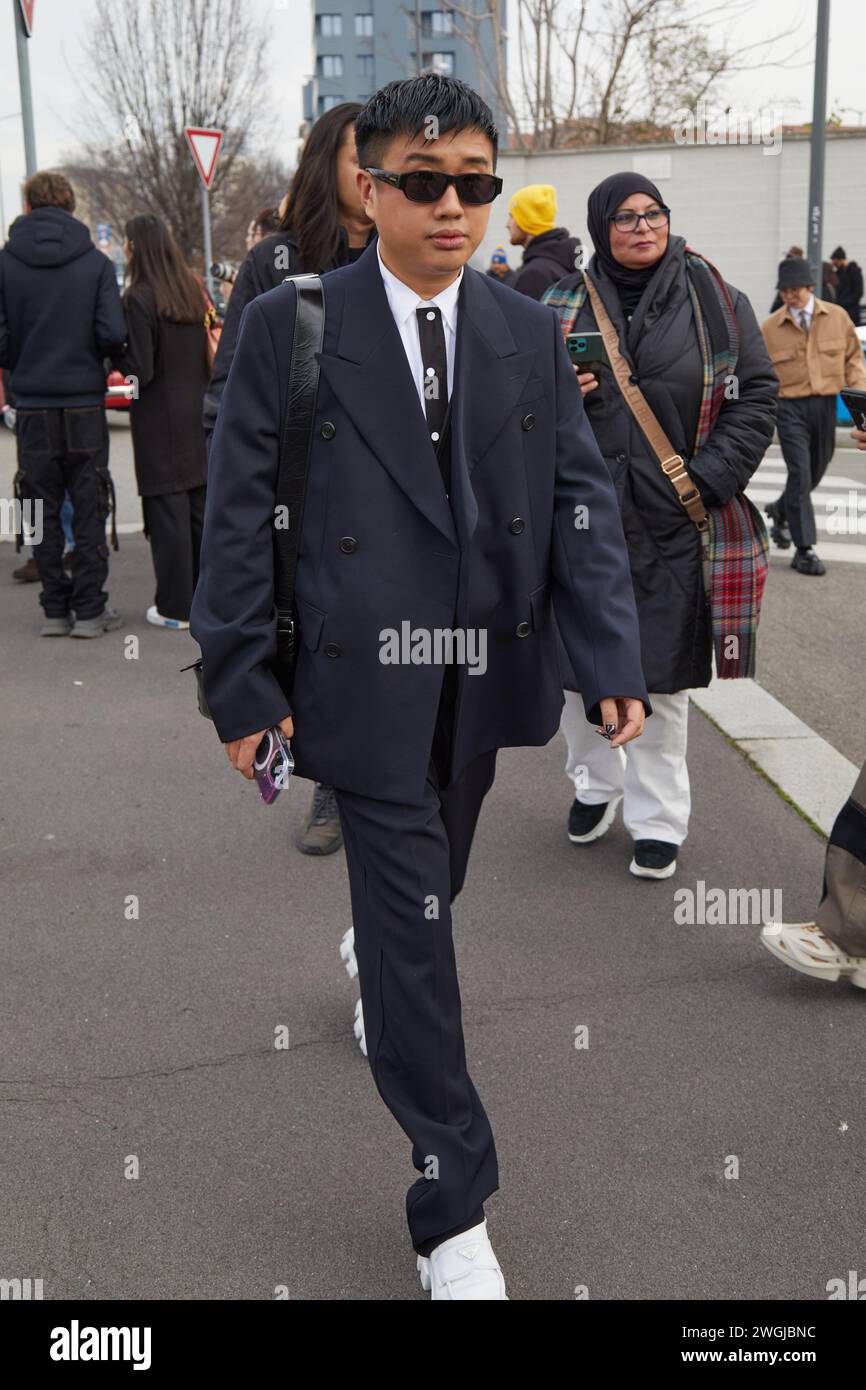 Declan Chan MILAN, ITALY - JANUARY 14, 2024: Declan Chan before Prada fashion show ...