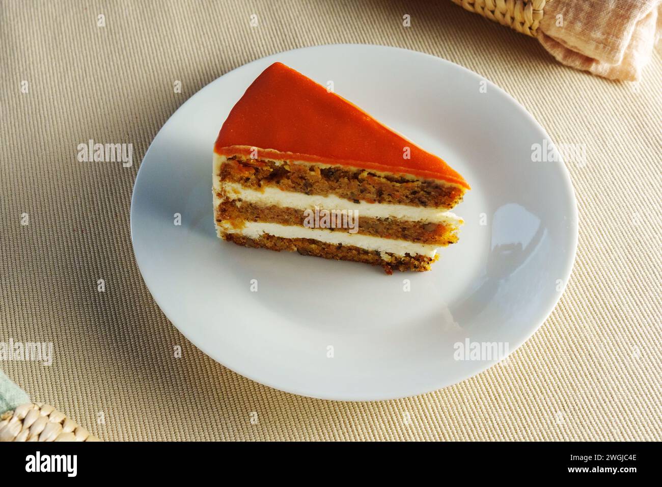 Deliciously Moist Carrot Cake Served on a Clean, White Plate Stock Photo