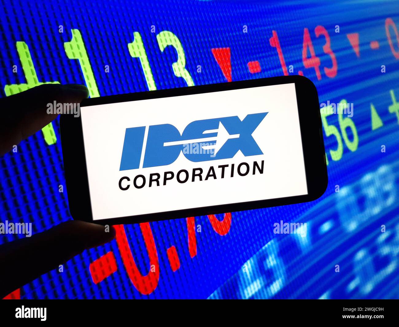 Konskie, Poland - February 04, 2024: IDEX Corporation company logo displayed on mobile phone screen Stock Photo