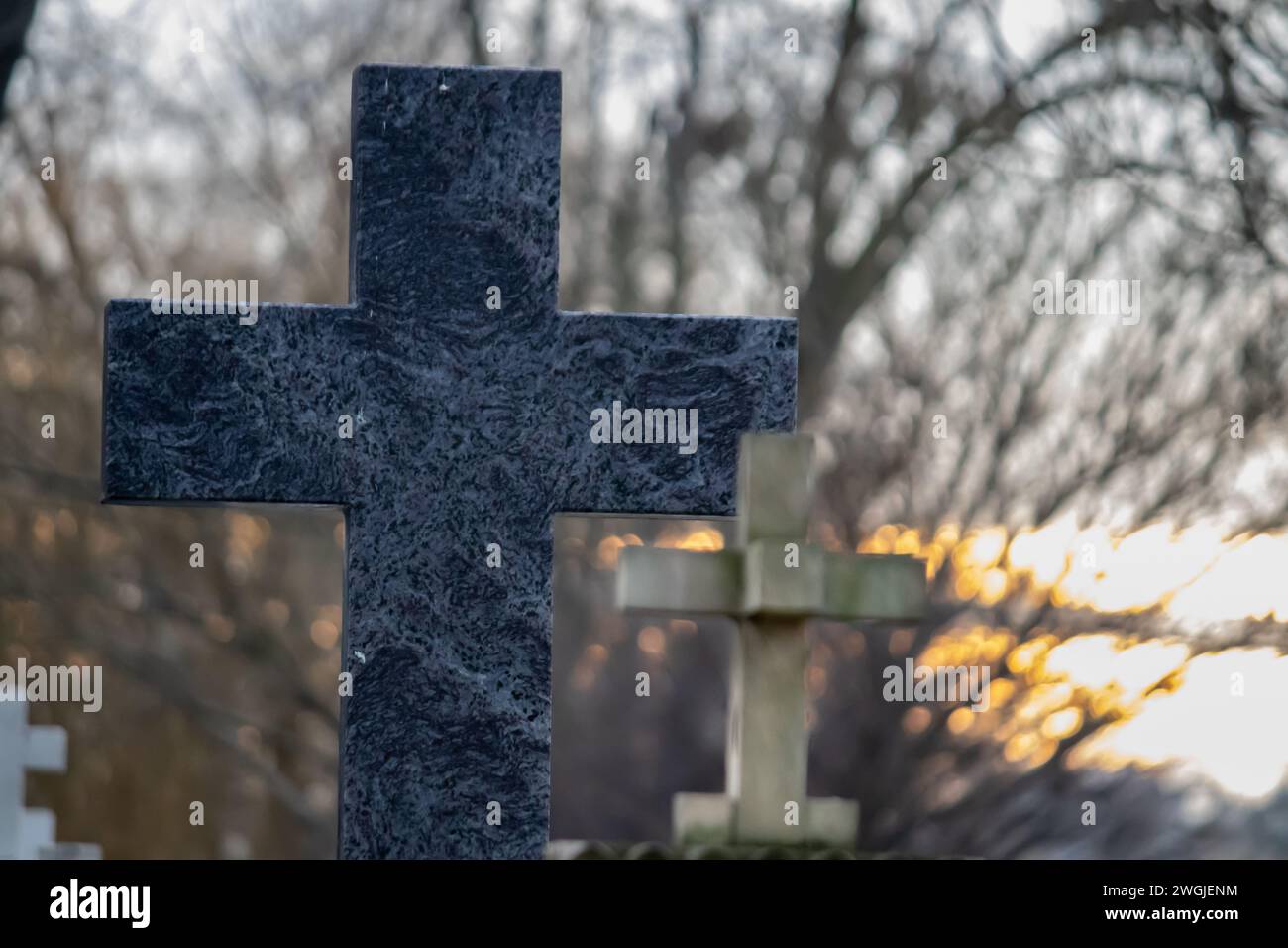 Marble and stone crosses at city graveyard, rest in peace to the dead ones Stock Photo