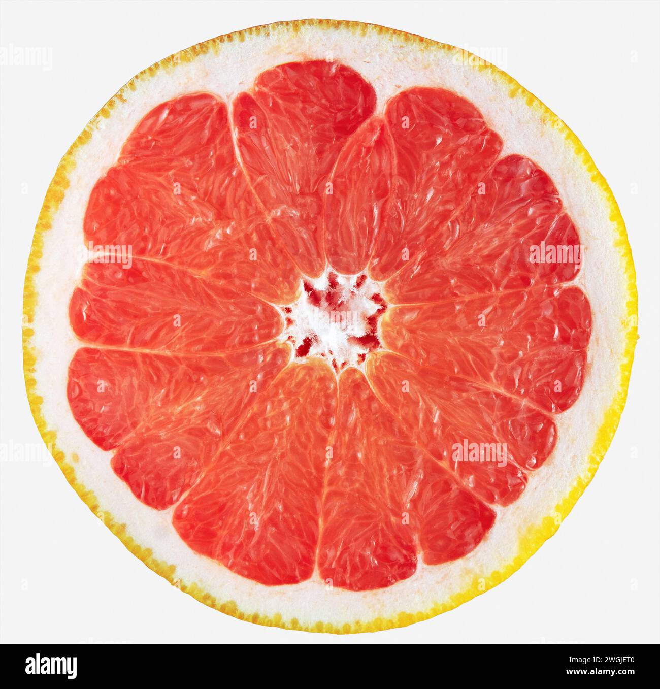 Grapefruit slice isolated on white. Fresh sliced red grapefruit. Stock Photo