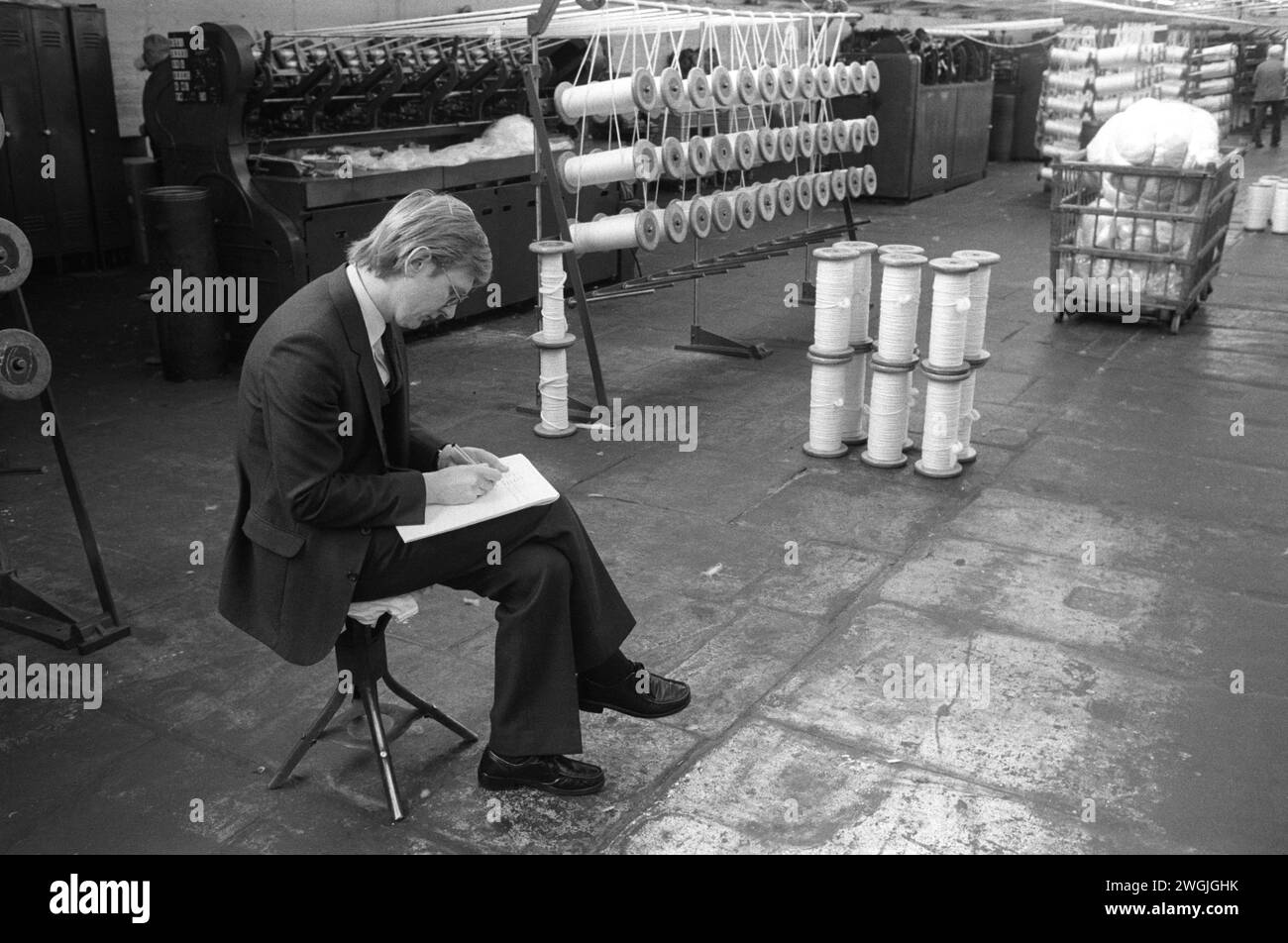 Salts Mill. Saltaire near Shipley, Bradford, West Yorkshire England 1981. The Managing Director of Salts Mill, A Victorian cotton textile mill. The factory building was so large that he used to spend quite a lot of the day working on the factory floor rather than in his office. 1980s UK HOMER SYKES Stock Photo