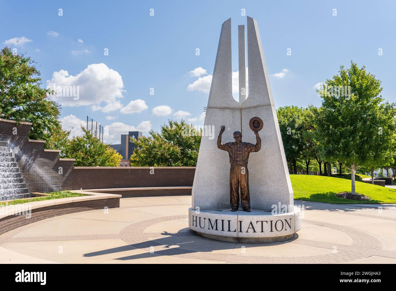 Tulsa, OK - Sept 16, 2021: In Hope Plaza, at Reconciliation Park, there are 3 sculptures depicting actual pictures from the 1921 race riot. 'Humiliati Stock Photo