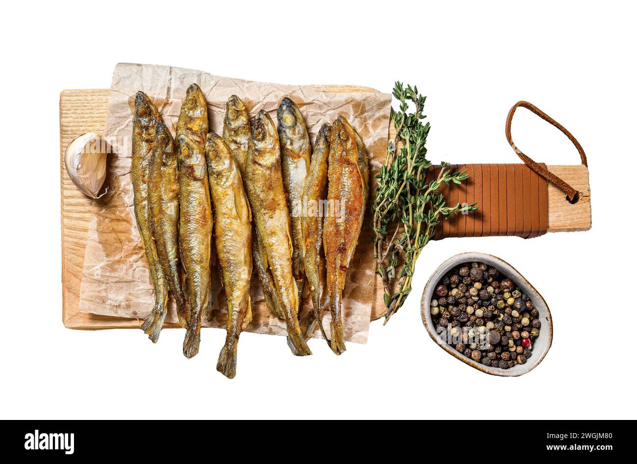 Fried smelt, sprats. Small fried fish. Isolated on white background. Top view Stock Photo