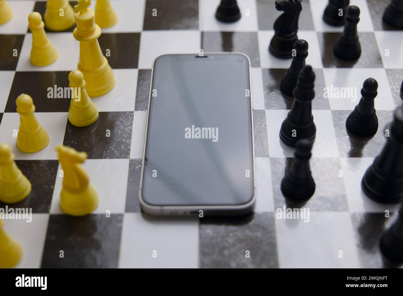 A captivating close-up of a chess game in progress on a smartphone screen Stock Photo