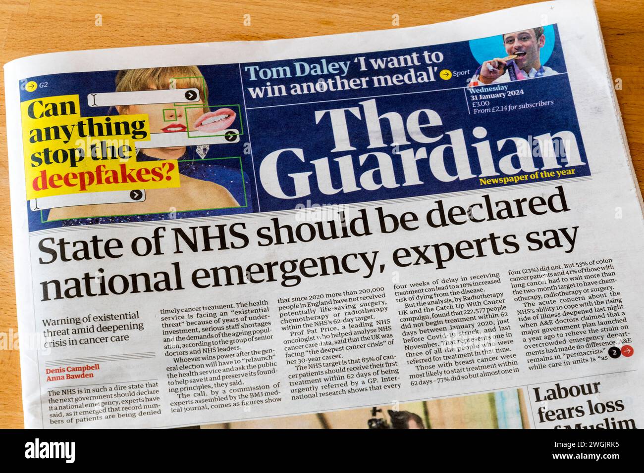 31 January 2024 headline in Guadian reads State of NHS should be declared national emergency, experts say. Stock Photo