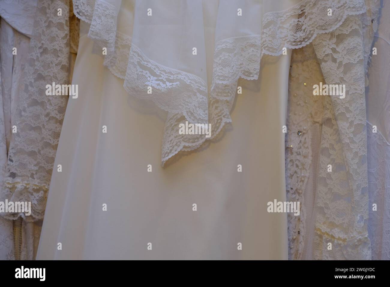 Vintage antique wedding dresses fabric details background. Stock Photo