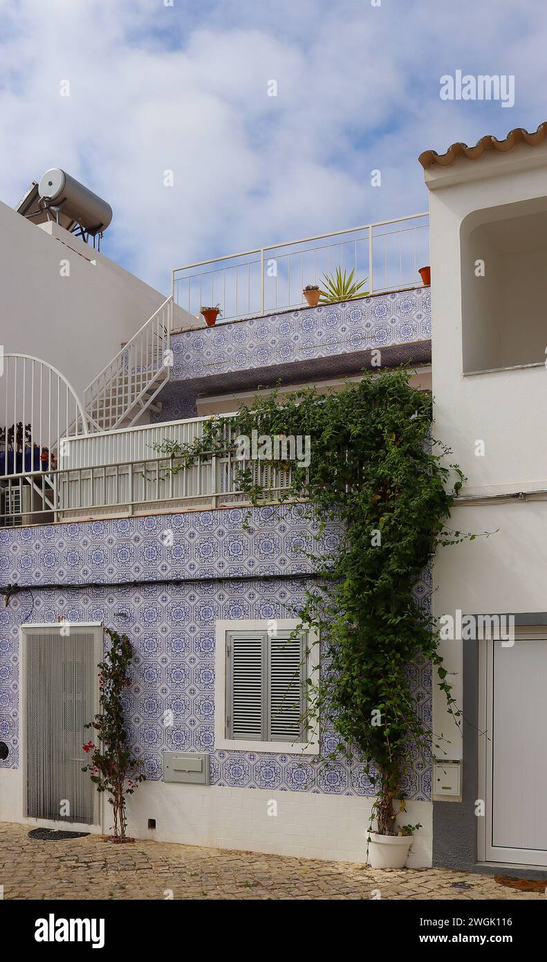 Residential home with traditional house facade decorated with Portuguese azulejo tiles, Tavira, Algarve, Portugal Stock Photo