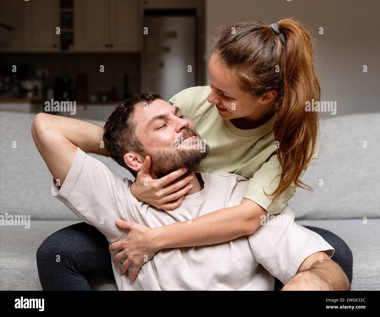 Heterosexual caucasian couple in love. Domestic lifestyle of happy young adult couple. Stock Photo