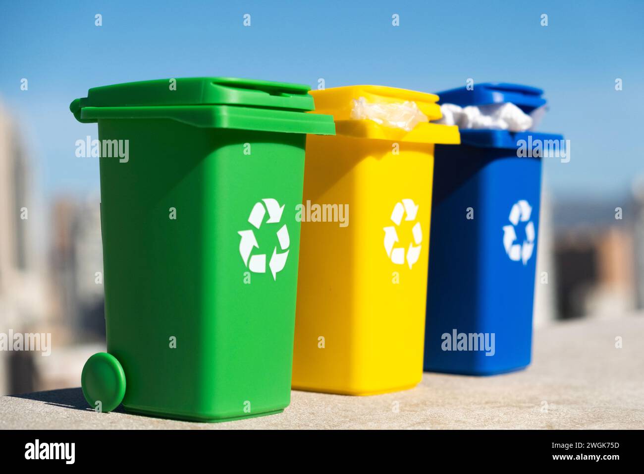 Container trash bin for recycling with city background. Yellow, green