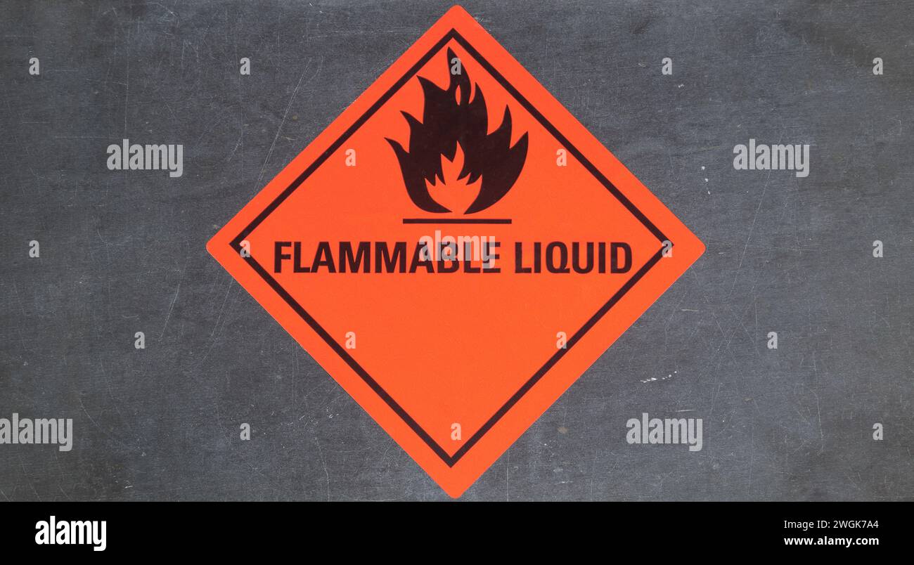 Flammable liquid sticker on gray stone background Stock Photo